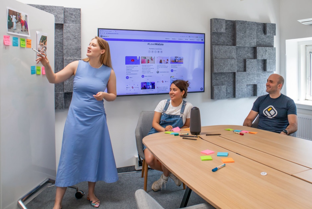 AI conference room with whiteboards and digital screens