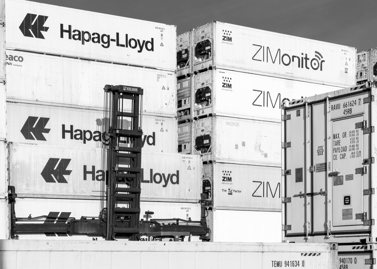 Cargo containers at a port representing the global export of Korean food products.