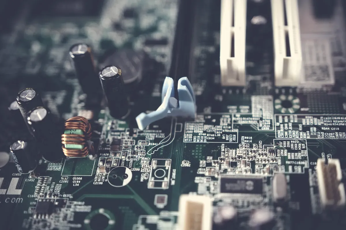 Detailed view of components on a computer motherboard, showcasing technology and circuitry.